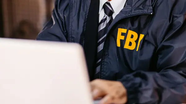 hacker looking at screen