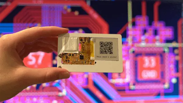 A close-up view of the Muxcard prototype showing its thin profile and integrated eInk display.