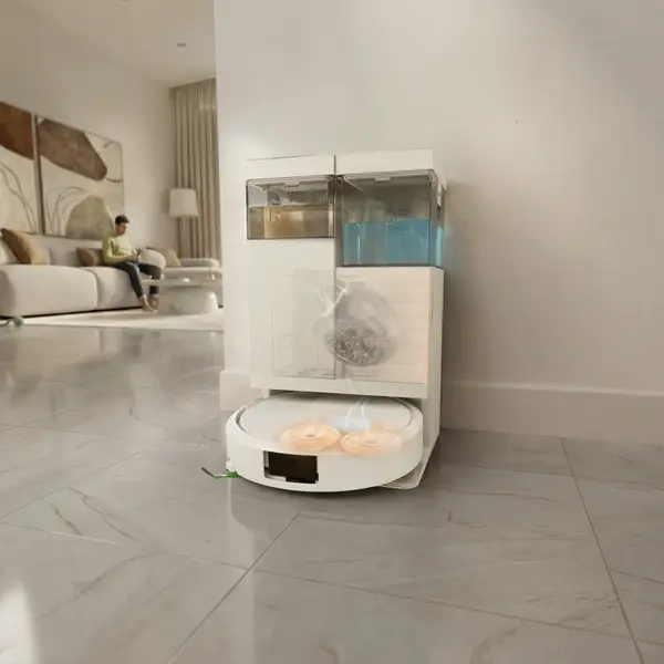 A sleek, modern Roomba robot vacuum navigates across a hardwood floor in a bright, contemporary living room setting.